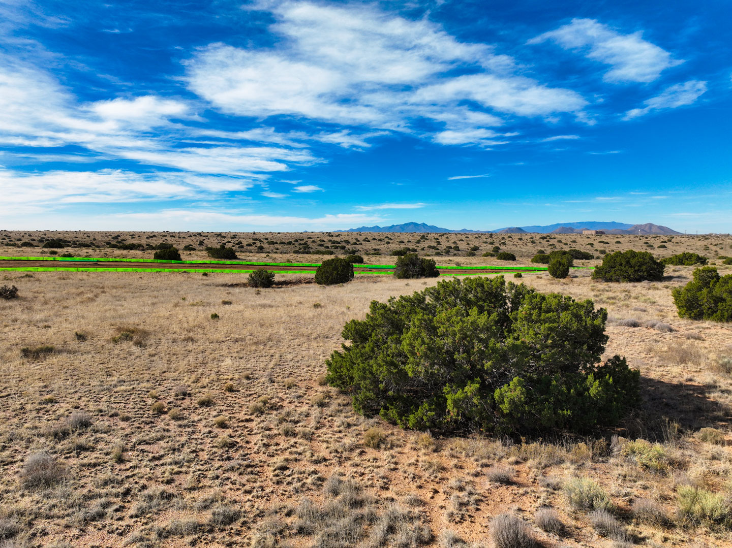 Ground level view of high desert landscape and open land at Esencia de Santa Fe in Santa Fe New Mexico