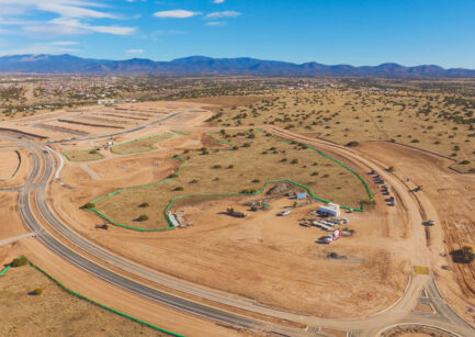 Aerial view of Esencia de Santa Fe community development showing graded lots and roads under construction in Santa Fe, New Mexico